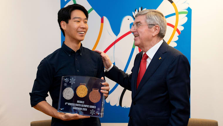 Winner of medal design competition presented with a set of “his” medals by IOC President Bach