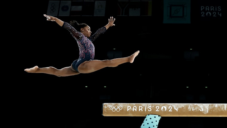 Simone Biles shakes off soreness to dazzle in Olympic return