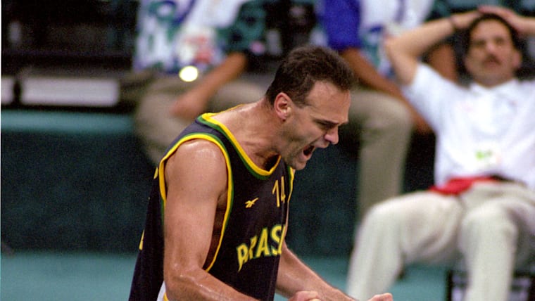 Oscar Schmidt #14 of Brazil celebrates against Puerto Rico during the 1996 Summer Olympic Games 