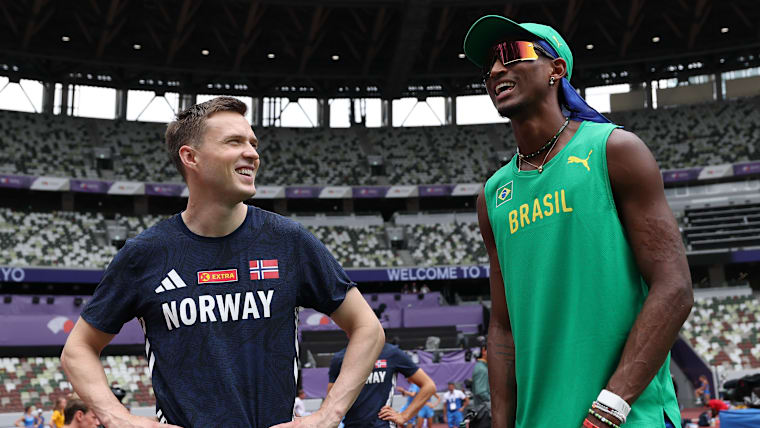Karsten Warholm (L) and Alison dos Santos at the 2025 World Championships
