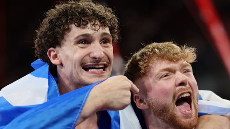 Silver medalist Reuben Ward and bronze medalist Cameron Lynn of Team Scotland celebrate after the men's pommel horse final at Glasgow 2026 Commonwealth Games