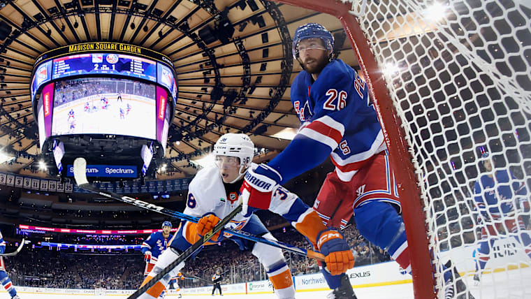 Marcus Pettersso of the New York Rangers defends against Victor Eklund of the New York Islanders at Madison Square Garden