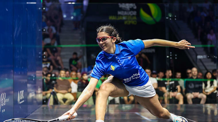 Amina Orfi reaaches for a ball