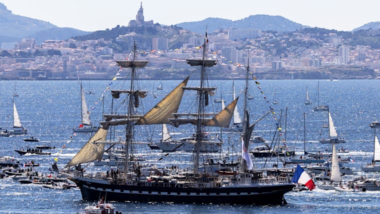 The Belem which is carrying the Olympic flame, is accompanied by other boats approaching Marseille