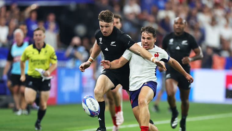Beauden Barrett of New Zealand and Antoine Dupont of France compete for the loose ball during the Rugby World Cup France 2023