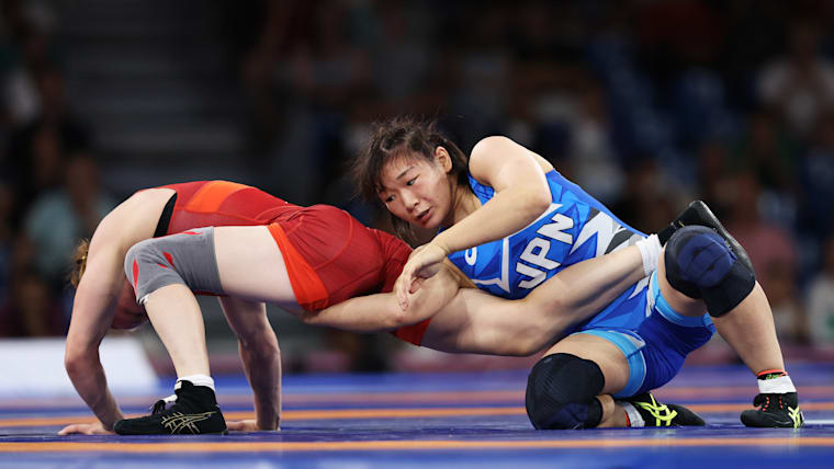 Motoki Sakura of Japan (in blue) wins gold medal in women's 62kg freestyle wrestling over Iryna Koliadenko of Ukraine at Paris 2024