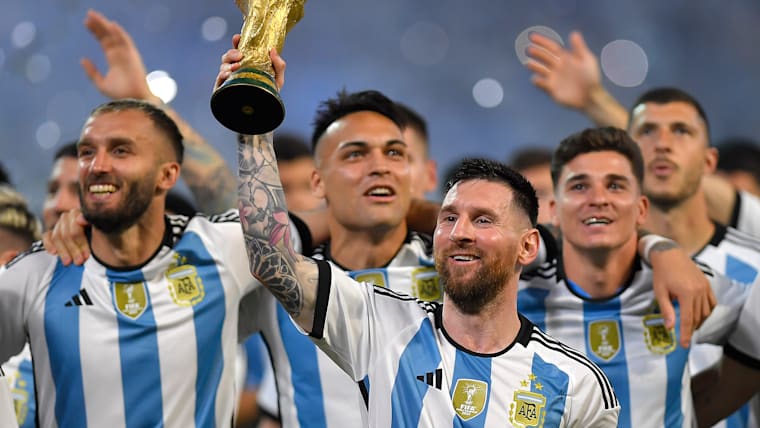 Lionel Messi and Argentina with the World Cup trophy, which they won for the third time in 2022.
