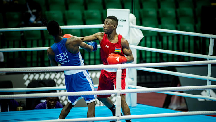 Richarno Collin of Mauritius (R) on his way to victory against Senegal's Souleymane Diallo