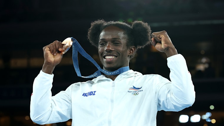 Bronze Medalist David de Pina of Team Cape Verde celebrates on the podium during the Boxing Men's 51kg medal ceremony after the Boxing Men's 51kg Final match on day thirteen of the Olympic Games Paris 2024 at Roland Garros on August 08, 2024 in Paris, France.