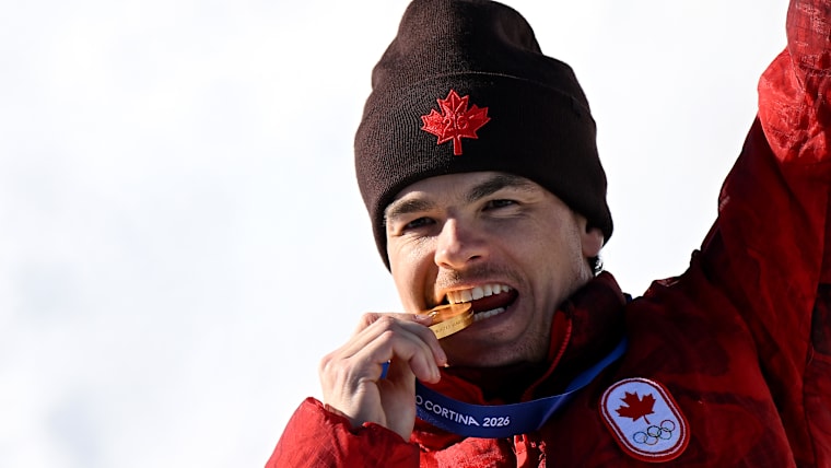 Mikael Kingsbury (CAN) celebrates on the podium at the Winter Olympic Games Milano Cortina 2026