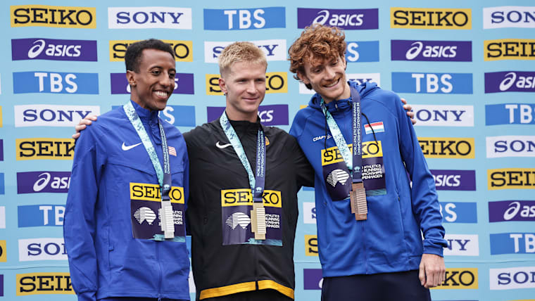 Robert Farken of Germany, Yared Nuguse of Team USA and Ruben Querinjean of  Luxembourg pose for a podium photo during the World Athletics Road Running Championships on September 19, 2026 in Copenhagen, Denmark.