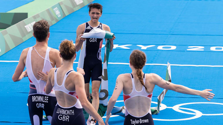 Jessica Learmonth, Jonathon Brownlee, Georgia Taylor-Brown and Alex Yee of Team Great Britain celebrate on the podium during the medal ceremony following the Mixed Relay Triathlon on day eight of the Tokyo 2020 Olympic Games at Odaiba Marine Park on July 31, 2021 in Tokyo, Japan. (Photo by Leon Neal/Getty Images)