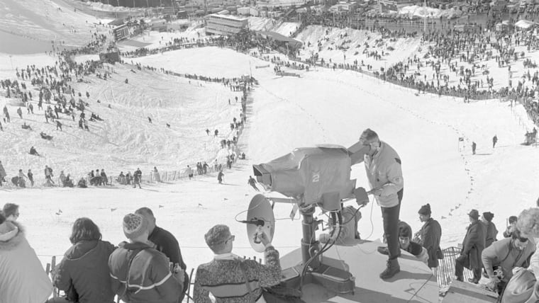 A television camera capturing the womens’ downhill ski event (location) during the Olympic Winter Games in 1968, Feb. 6, 1968.