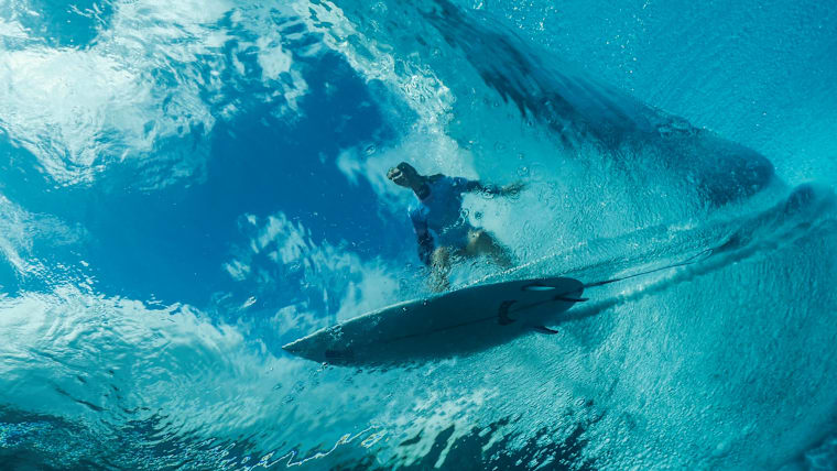 Paris 2025 Olympic champion Caroline Marks surfs in Tahiti.