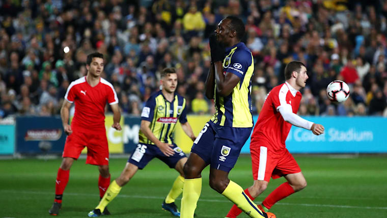 Bolt's football debut in pictures