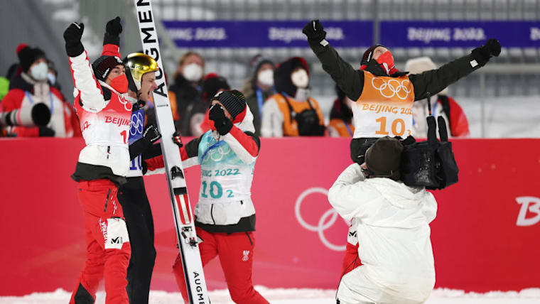 Stefan Kraft, Jan Hörl, Manuel Fettner and Daniel Huber celebrate Austria's gold medal in the men's team event in Beijing 2022
