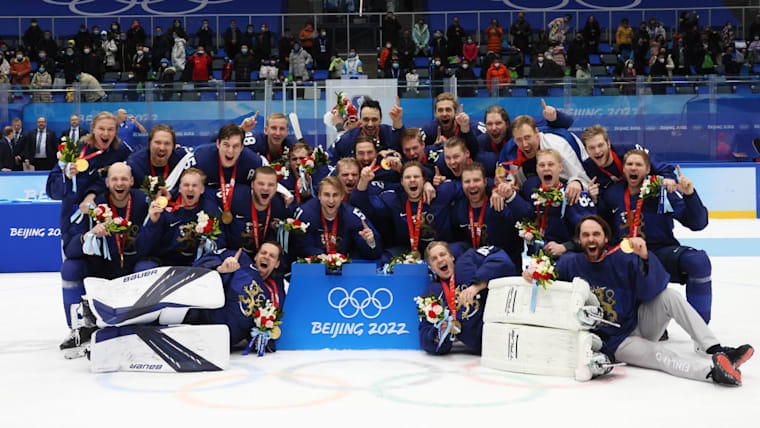 Members of Gold medallist Team Finland pose during the Men's Ice Hockey medal ceremony 