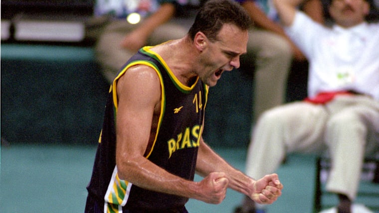 Oscar Schmidt #14 of Brazil celebrates against Puerto Rico during the 1996 Summer Olympic Games on July 20, 1996 in Atlanta, Georgia. Brazil defeated Puerto Rico 101-98.