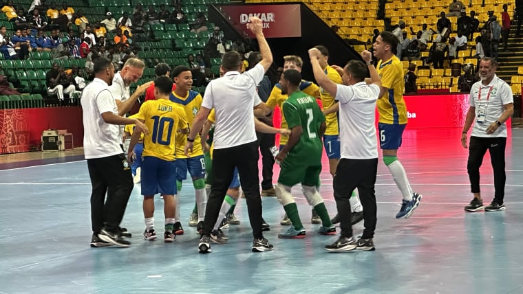 Brazil players celebrate after beating Portugal 3-1 in the final of the men's competition at the Dakar Arena.