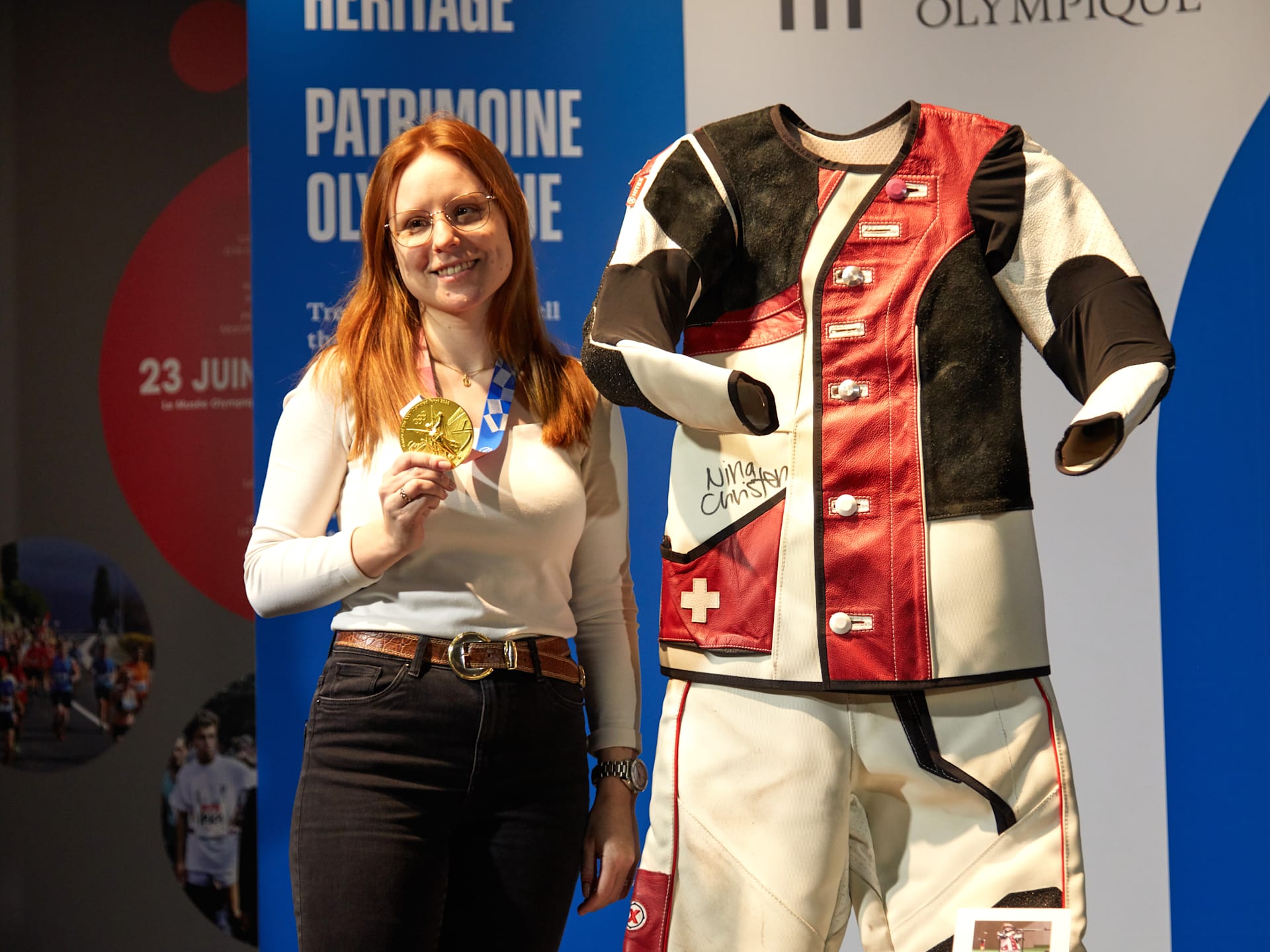 Olympian standing next to her equipment