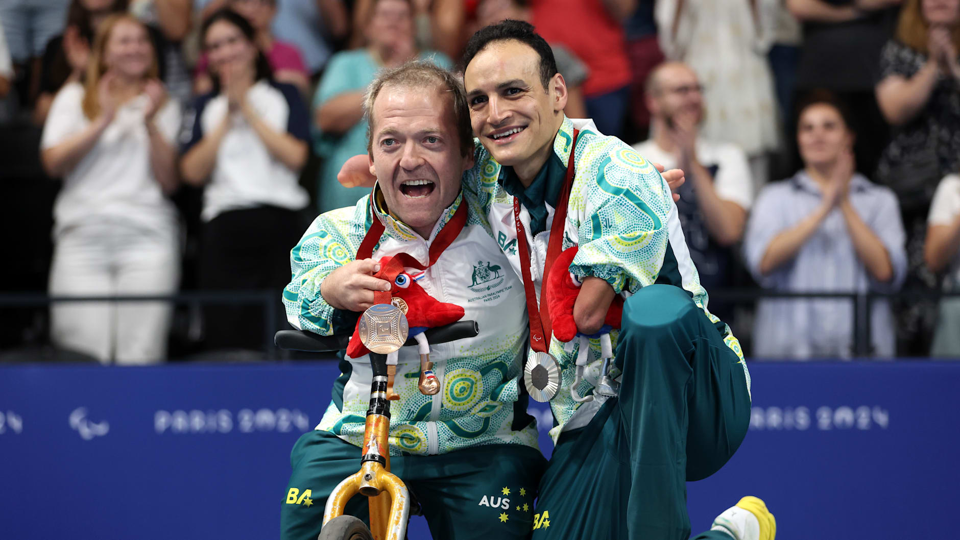 Silver medallist Ahmed Kelly (right) and Bronze medallist Grant Patterson (left) pose for a photo with their medals during the Men's 150m Individual Medley - SM3