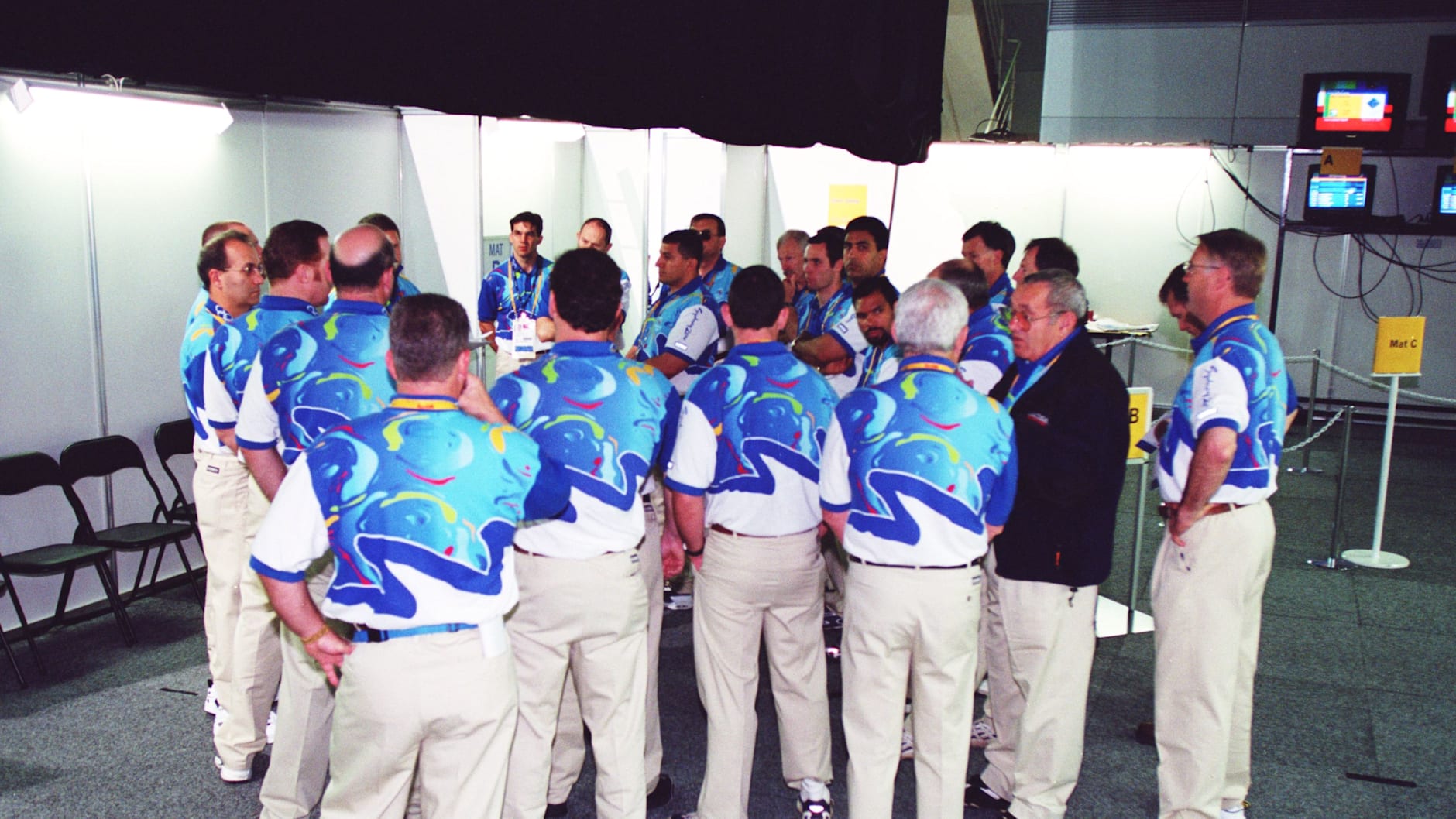 The volunteers stand in a group at the Sydney 2000 Olympic Games