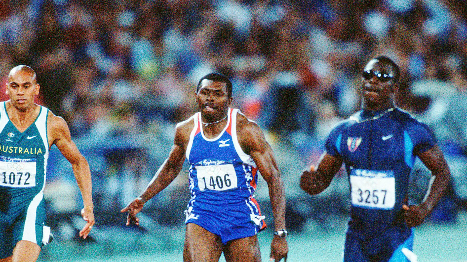 (Left to right) Patrick Johnson (AUS), Joseph Batangdon (CMR) and John Capel Jr (USA) during the Sydney 2000 Olympic Games 200m men's.