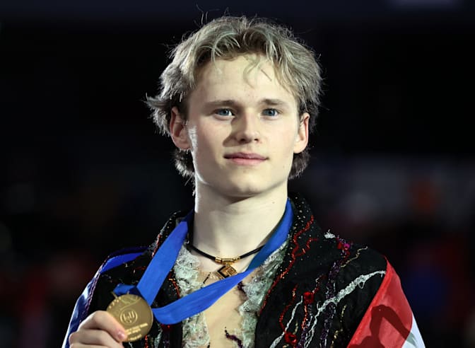 Ilia Malinin poses with his gold medal at the 2024 Grand Prix Final