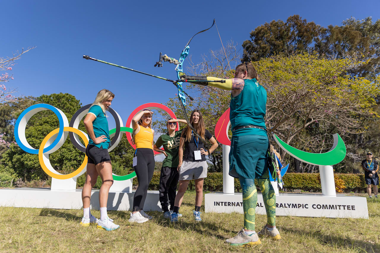 Taymon Kenton-Smith showing his bow with the Paralympic Agitos and Olympic Rings. Credit City of Gold Coast