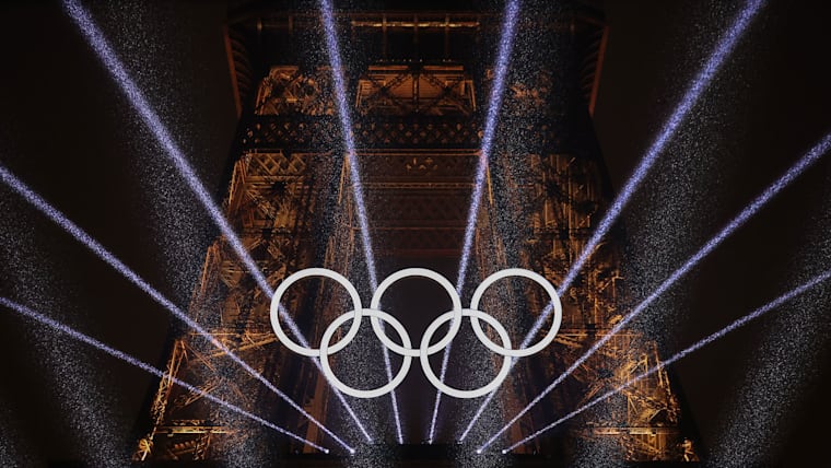 PARIS, FRANCE - JULY 26: A Light Show takes place as The Olympic Rings on the Eiffel Tower are illuminated during the opening ceremony of the Olympic Games Paris 2024 at Place du Trocadero on July 26, 2024 in Paris, France.