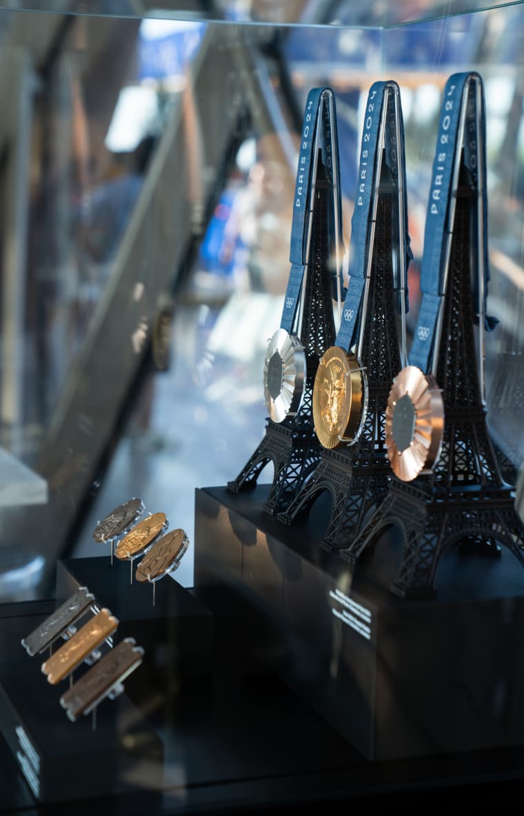 Paris 1900, 1924 and 2024 Olympic Games medals displayed at Gustave 24, Eiffel Tower, Paris.