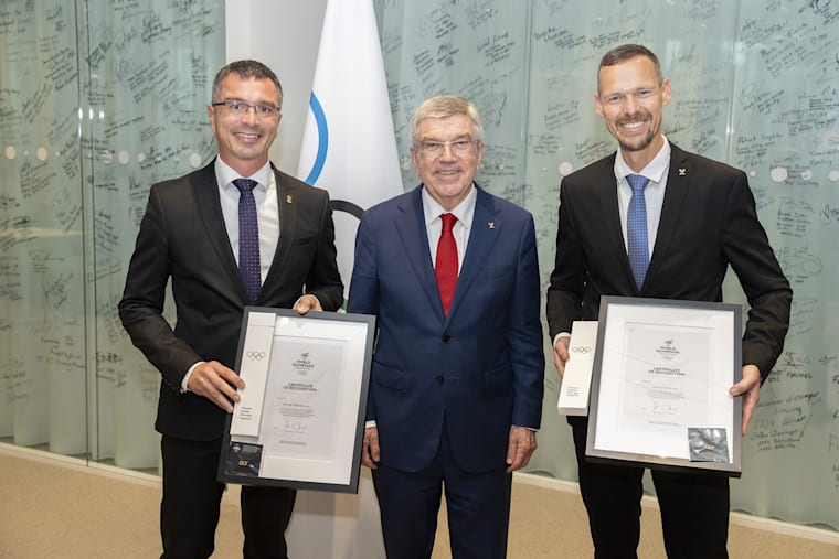 IOC / Greg Martin. The President with Slovak Olympians Peter Korčok and Matej Tóth.
