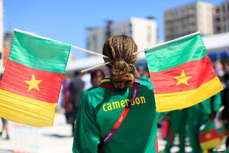 A Cameroon Olympic athlete flies the flag for her country