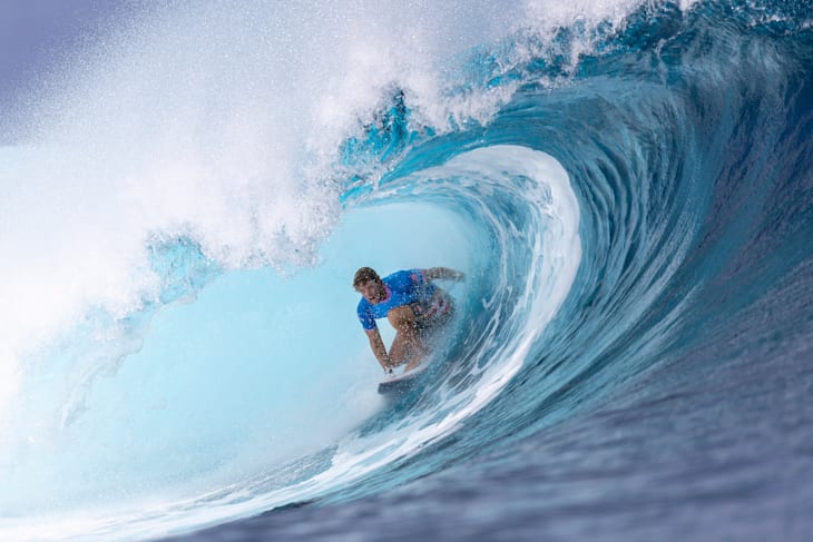 John John Florence (USA) riding deep in the barrel on the way to the day's highest heat score