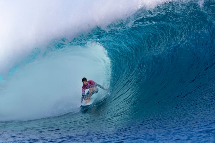 Robinson (AUS) sitting pretty in a big barrel during his Round 2 heat