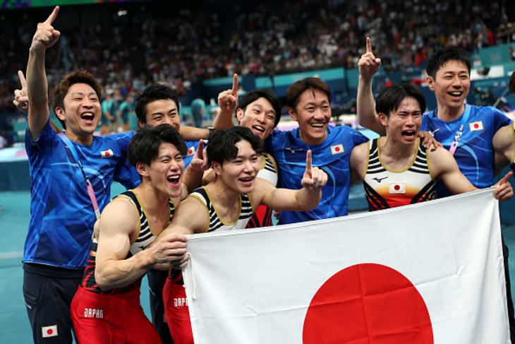 Athletes of Team Japan pose for a photo with coaching staff as they celebrate winning the gold medal during the Artistic Gymnastics Men's Team Final on day three of the Olympic Games Paris 2024 at Bercy Arena on July 29, 2024 in Paris, France