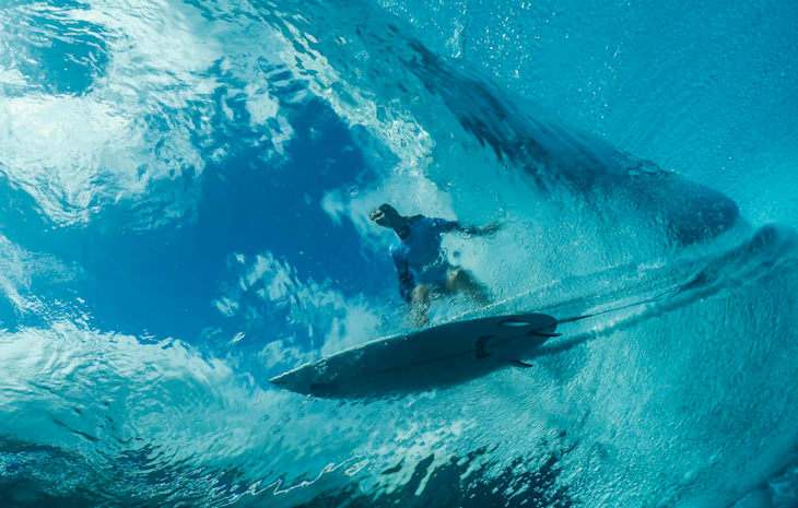 An underwater view of Caroline Marks (USA) setting up a barrel in Round 1