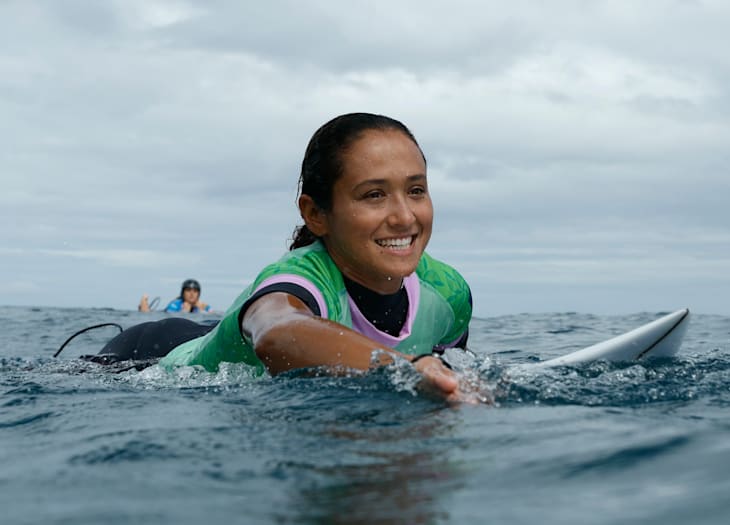 France's Vahine Fierro paddles back to the lineup with a smile on her way to winning her First Round heat