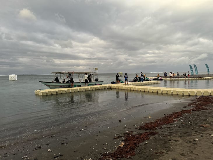 Officials prepare to check wave conditions in Tahiti on Day 2 of Paris 2024