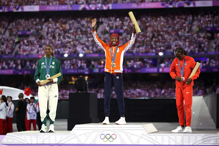 Sifan Hassan acknowledges the crowd during the women's marathon victory ceremony