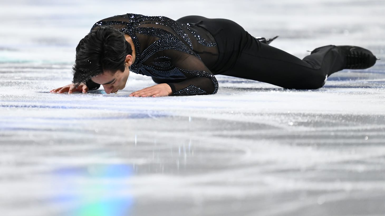 Donovan Carrillo of Mexico kisses the ice after competing in the Men's Short Program during the ISU World Figure Skating Championships at the Bell Centre on March 21, 2024 in Montreal, Quebec, Canada.