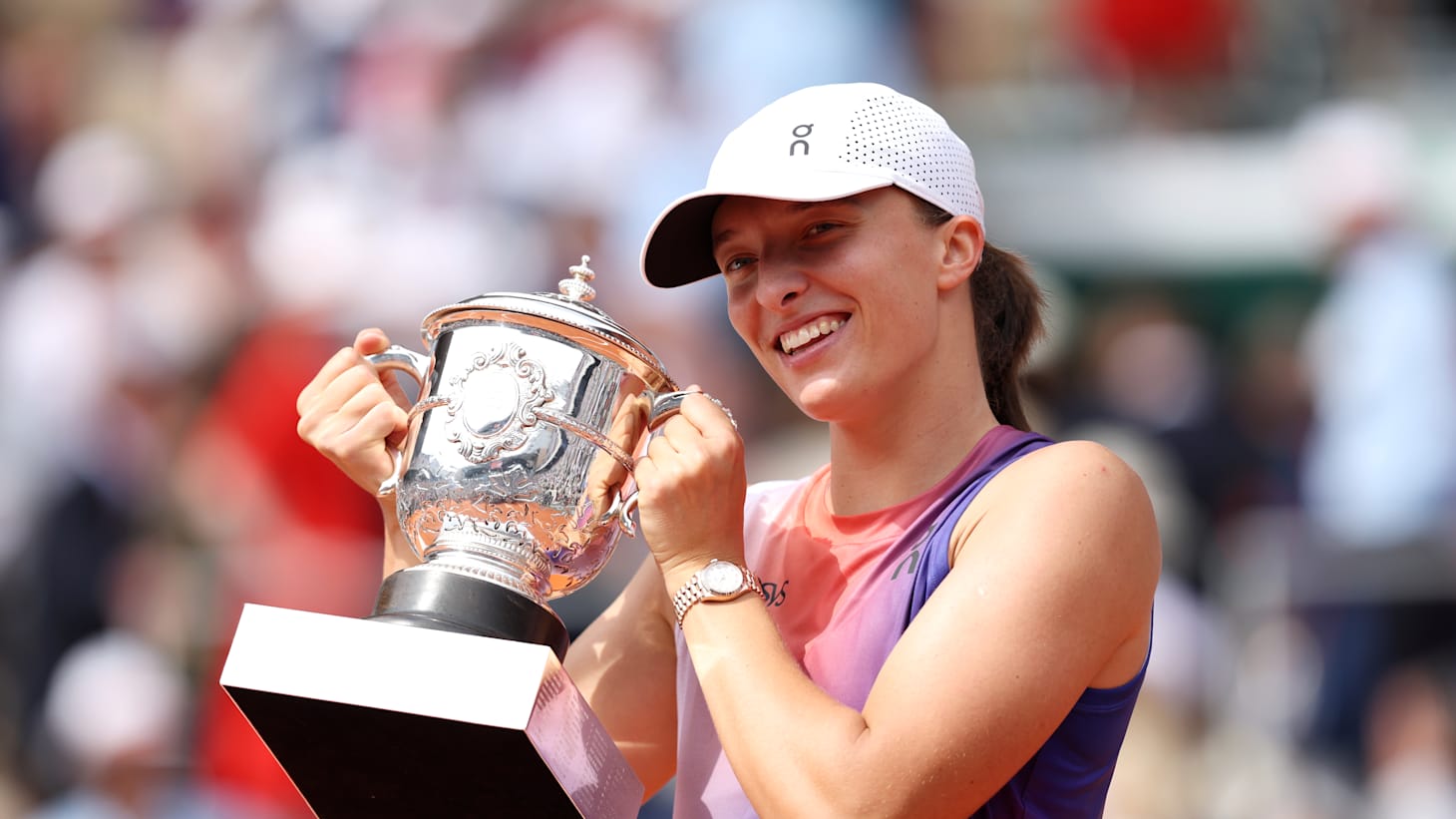 Iga Swiatek of Poland celebrates with her winners trophy after victory against Jasmine Paolini of Italy during the Women's Singles Final match on Day 14 of the 2024 French Open at Roland Garros on June 08, 2024 in Paris, France.