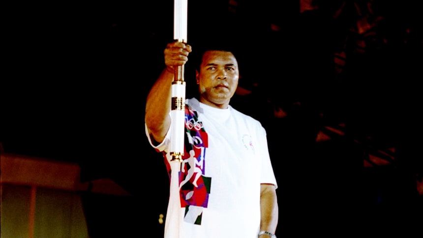 Muhammad Ali holds the torch before lighting the Olympic flame during the opening ceremony of the 1996 Olympic Games in Atlanta.