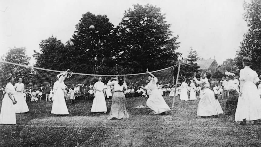 A group of ladies playing a game of volleyball in 1900.
