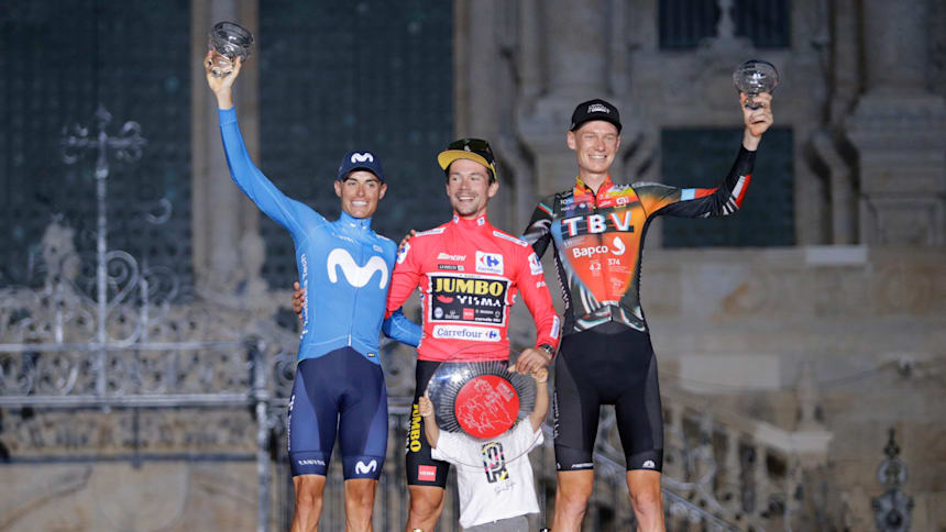Enric Mas (second), Primoz Roglic (first), and Jack Haig (third) celebrate on the 2021 Vuelta a España podium.