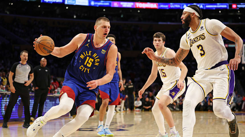 Nikola Jokic of the Denver Nuggets drives against Anthony Davis of the Los Angeles Lakers.