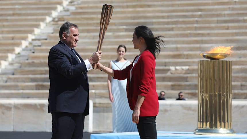 Olympic flame handover ceremony delivers message of hope