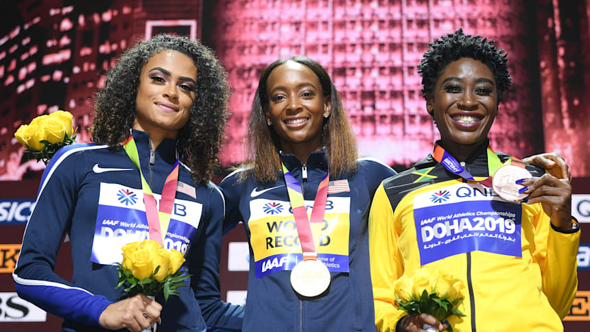 Sydney McLaughling [left] on the podium following her silver medal at the 2019 world championships in Doha