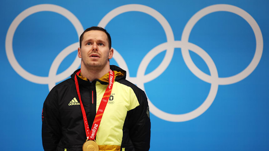 Gold medallist Christopher Grotheer of Team Germany during the Men's Skeleton medal ceremony