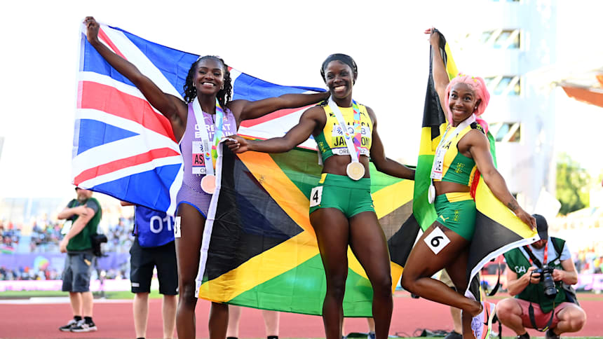Bronze medallist Dina Asher-Smith of Great Britain, gold medallist Shericka Jackson of Jamaica, and silver medalist Shelly-Ann Fraser-Pryce of Jamaica celebrate after the women's 200m final at the 2022 World Athletics Championships. (Photo by Hannah Peters/Getty Images for World Athletics)